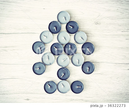 Symbolic christmas tree of tea lights, blue filter 36322273