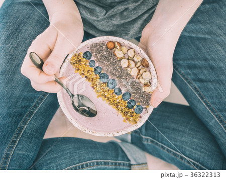 Breakfast bowl in woman hands 36322313