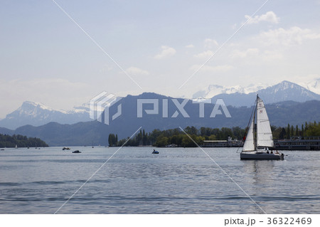 A yacht is sailing on the water. Swiss town.  36322469
