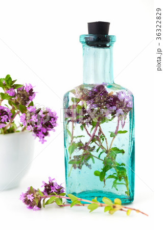 Vintage bottle of thyme infusion and mortar 36322829