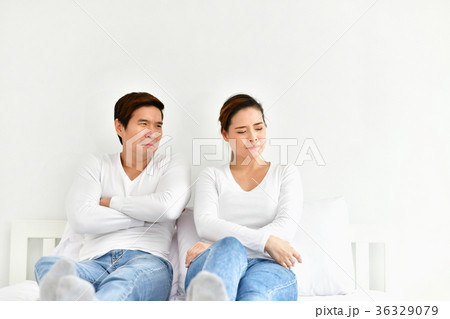 A couple lover is upset about something in the bedroom. 36329079