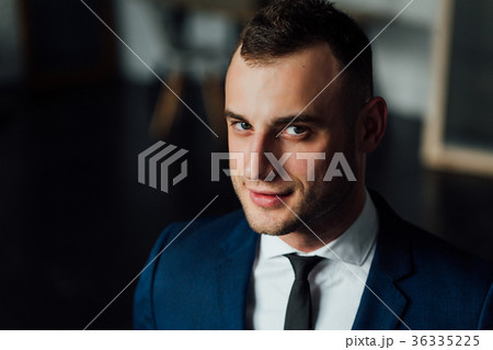 Young attractive and confident businessman in blue 36335225