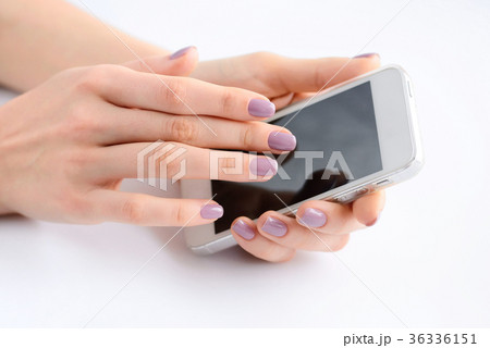 Women's hands holding mobile phone 36336151