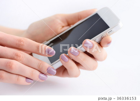 Women's hands holding mobile phone Women's hands holding mobile phone 36336153