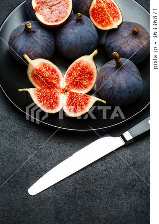 Fig isolated on dark concrete background Fig isolated on dark concrete background 36336871