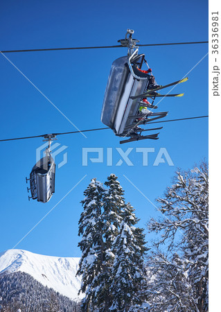 Skiers on the chairlift 36336981