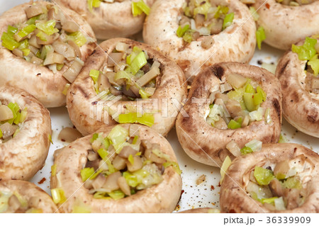 Raw champignon mushrooms, stuffed with vegetables 36339909