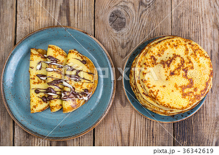 Pancakes stuffed with chocolate sauce, for 36342619