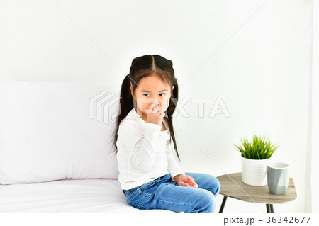 Little girl is being annoyed by an adult. 36342677