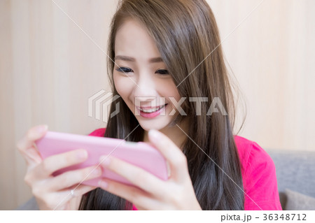 woman play mobile game woman play mobile game 36348712