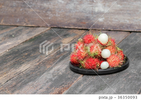 rambutan sweet fruit in plate on wood background rambutan sweet fruit in plate on wood background 36350093