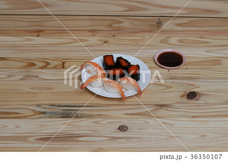 Sushi Close up in black plate on wooden background 36350107
