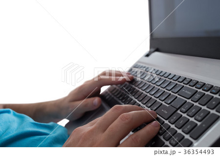 Man's hands typing on laptop notebook keyboard 36354493