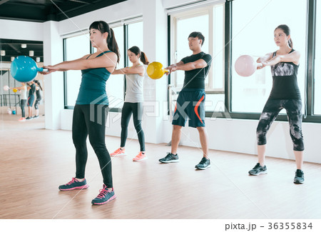 player exercise with kettlebell lifting up 36355834