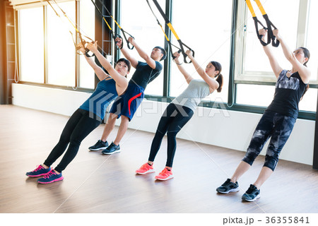 team of Asian people training with TRX 36355841