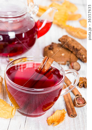 Fruit tea with cookies on wooden background Fruit tea with cookies on wooden background 36357635