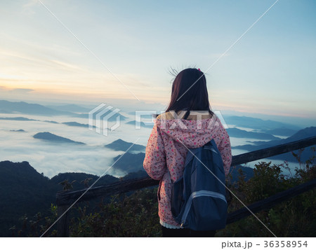 girl with backpack enjoying sunrise on mountain girl with backpack enjoying sunrise on mountain 36358954