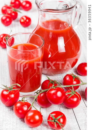 Tomato juice on a wooden background Tomato juice on a wooden background 36359941