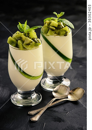 Italian dessert -pannacotta with kiwu fruit. 36362403