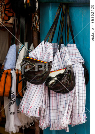 Colombian traditional leather carriel and poncho 36362429