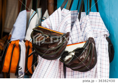 Colombian traditional leather carriel and poncho 36362430