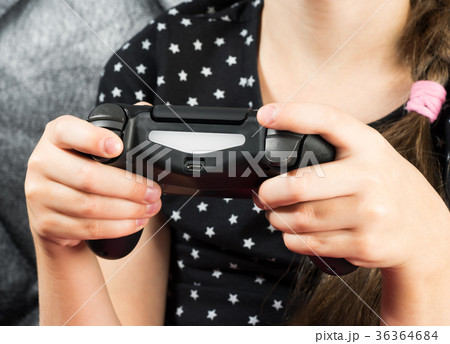 Child girl is playing video games 36364684