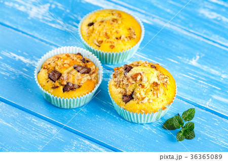 Fresh muffins with nuts and chocolate 36365089