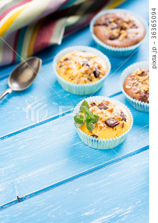 Fresh muffins with nuts and chocolate 36365094