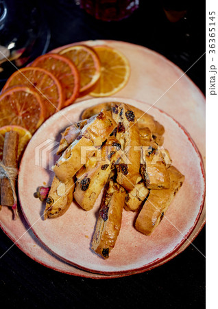 Cookie biscotti on a plate with orange slices.The Cookie biscotti on a plate with orange slices.The 36365145