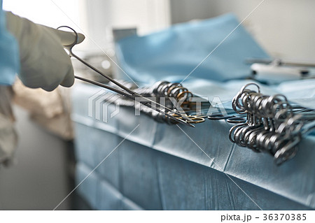 Nurse is taking forceps Nurse is taking forceps 36370385
