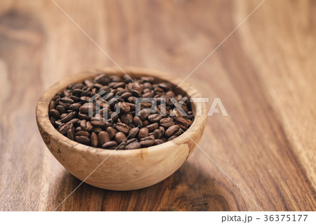 fresh roasted coffee beans in wood bowl on table fresh roasted coffee beans in wood bowl on table 36375177