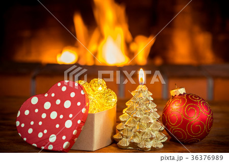 Christmas tree decorations near fireplace 36376989
