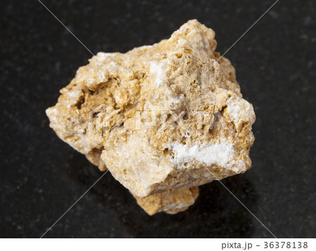 raw travertine stone on dark background 36378138