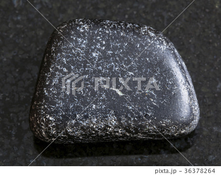 polished Chromite stone on dark background polished Chromite stone on dark background 36378264