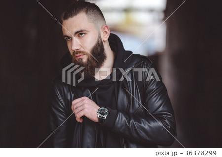 Modern young bearded man in black style clothes Modern young bearded man in black style clothes 36378299
