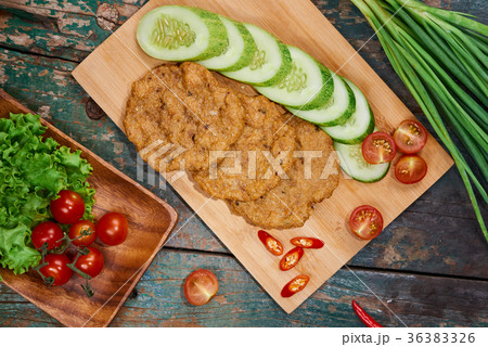 Vietnam fried fish patty with vegetable and sauce. 36383326
