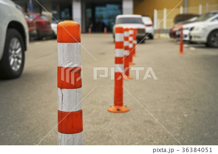 Plastic restricting bollards on the parking area Plastic restricting bollards on the parking area 36384051