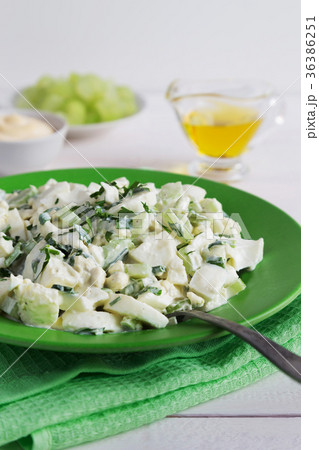 Plate of celery salad with dressing and olive oil Plate of celery salad with dressing and olive oil 36386251