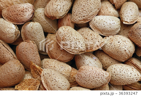 Whole raw almond nuts with shell close up Whole raw almond nuts with shell close up 36393247