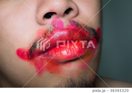 Mouth stained the color of lipstick. 36393320
