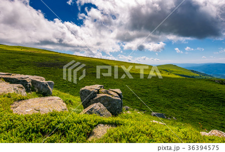 giant boulders on grassy slopes of Polonina Runa 36394575