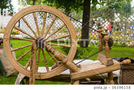 Old wooden worker spinning wheel 36396158