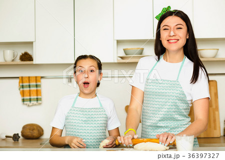 happy mother and daughter cooking dough happy mother and daughter cooking dough 36397327