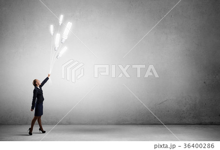 Woman with bulb balloon 36400286