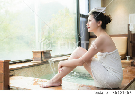 japan girl sitting on poolside of hot springs 36401262