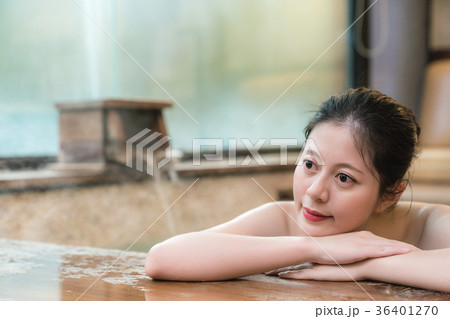 japanese girl takes a rest lying down on poolside 36401270