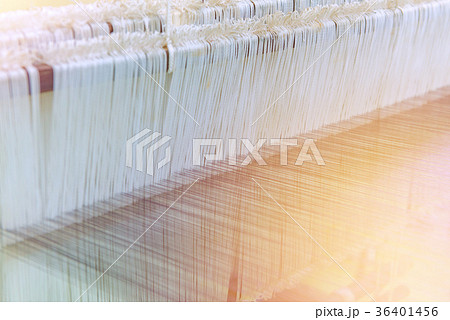 Weaving loom and shuttle on the warp Weaving loom and shuttle on the warp 36401456