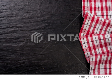 Red checkered tablecloth on a dark stone Red checkered tablecloth on a dark stone 36402177