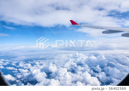 Clouds and sky as seen through window of an Clouds and sky as seen through window of an 36402569
