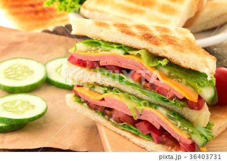 Sliced Grilled sandwiches bread with bacon  Sliced Grilled sandwiches bread with bacon  36403731